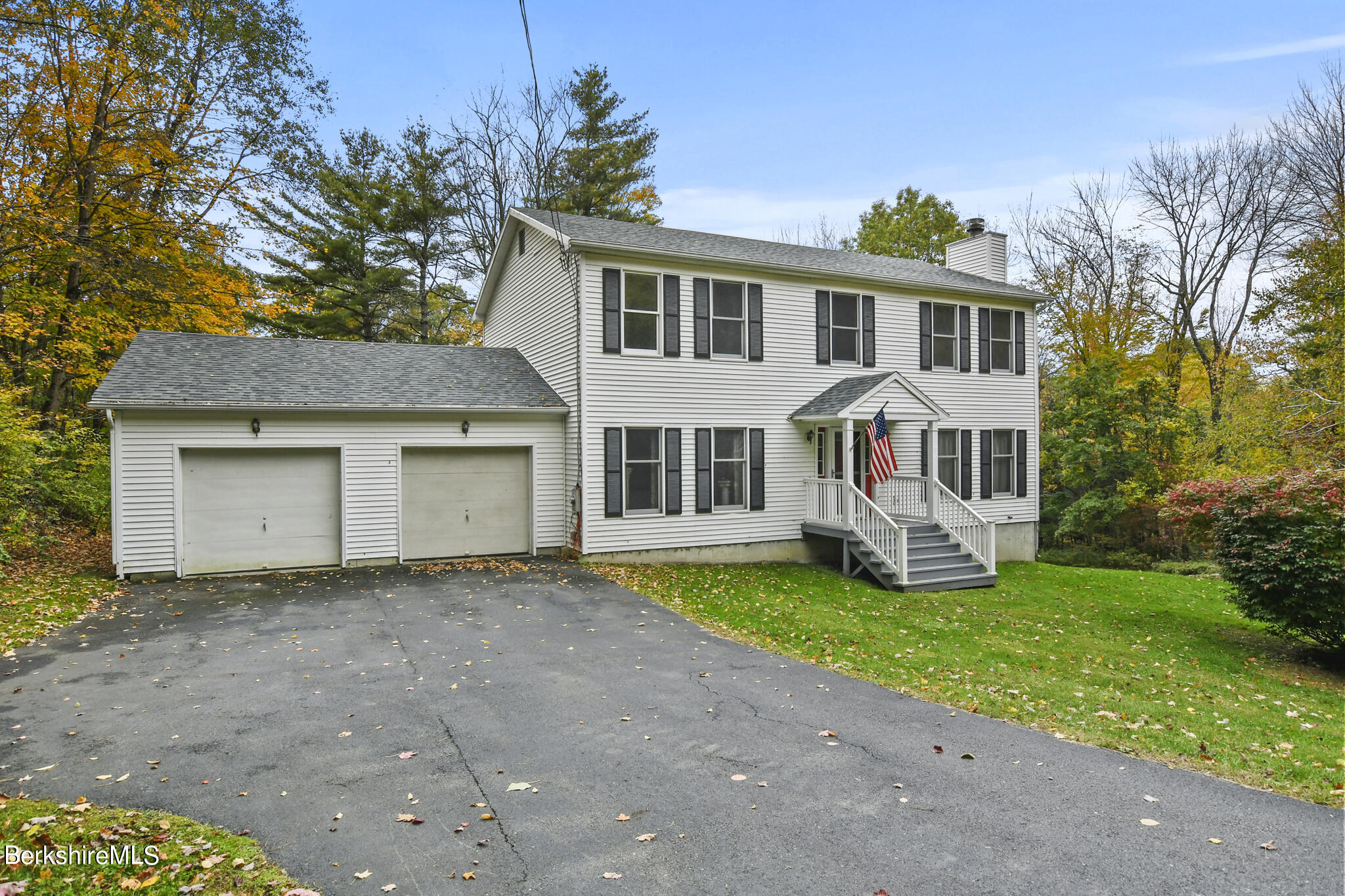 781 E Road Clarksburg, MA 01247 - Photo 2 of 51 a house that has a big yard and more windows