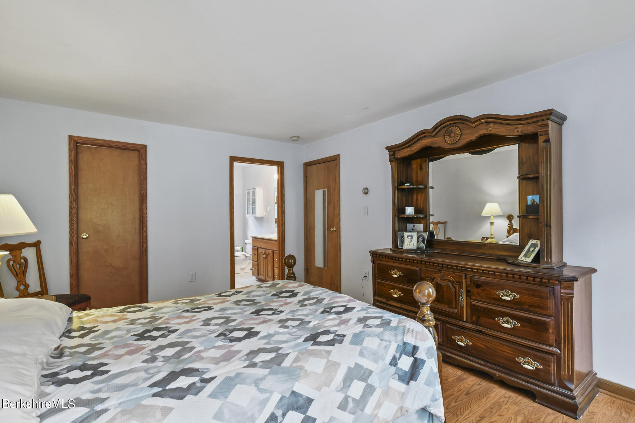 781 E Road Clarksburg, MA 01247 - Photo 26 of 51 a bedroom with a bed and a mirror on dresser