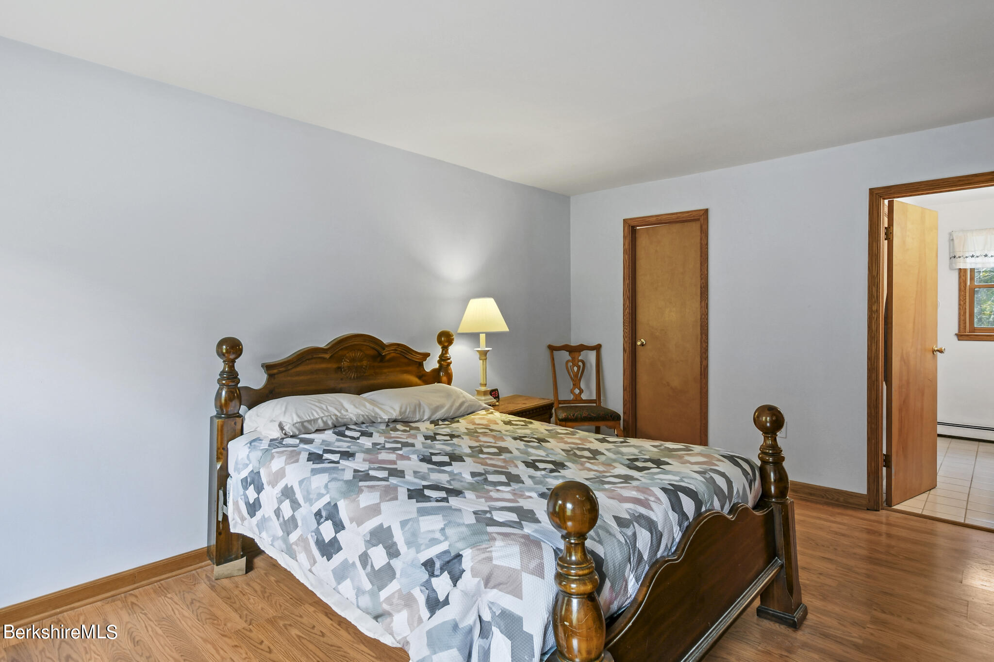 781 E Road Clarksburg, MA 01247 - Photo 27 of 51 a bedroom with a bed and wooden floor
