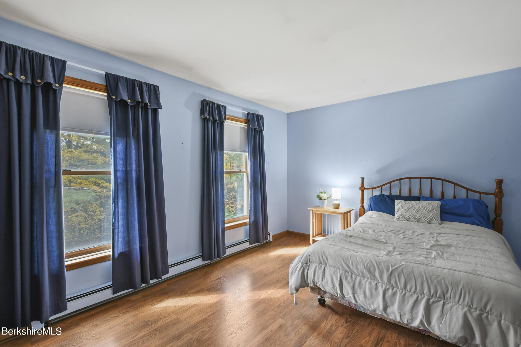 781 E Road Clarksburg, MA 01247 - Photo 31 of 51 a bedroom with a large bed and a large window