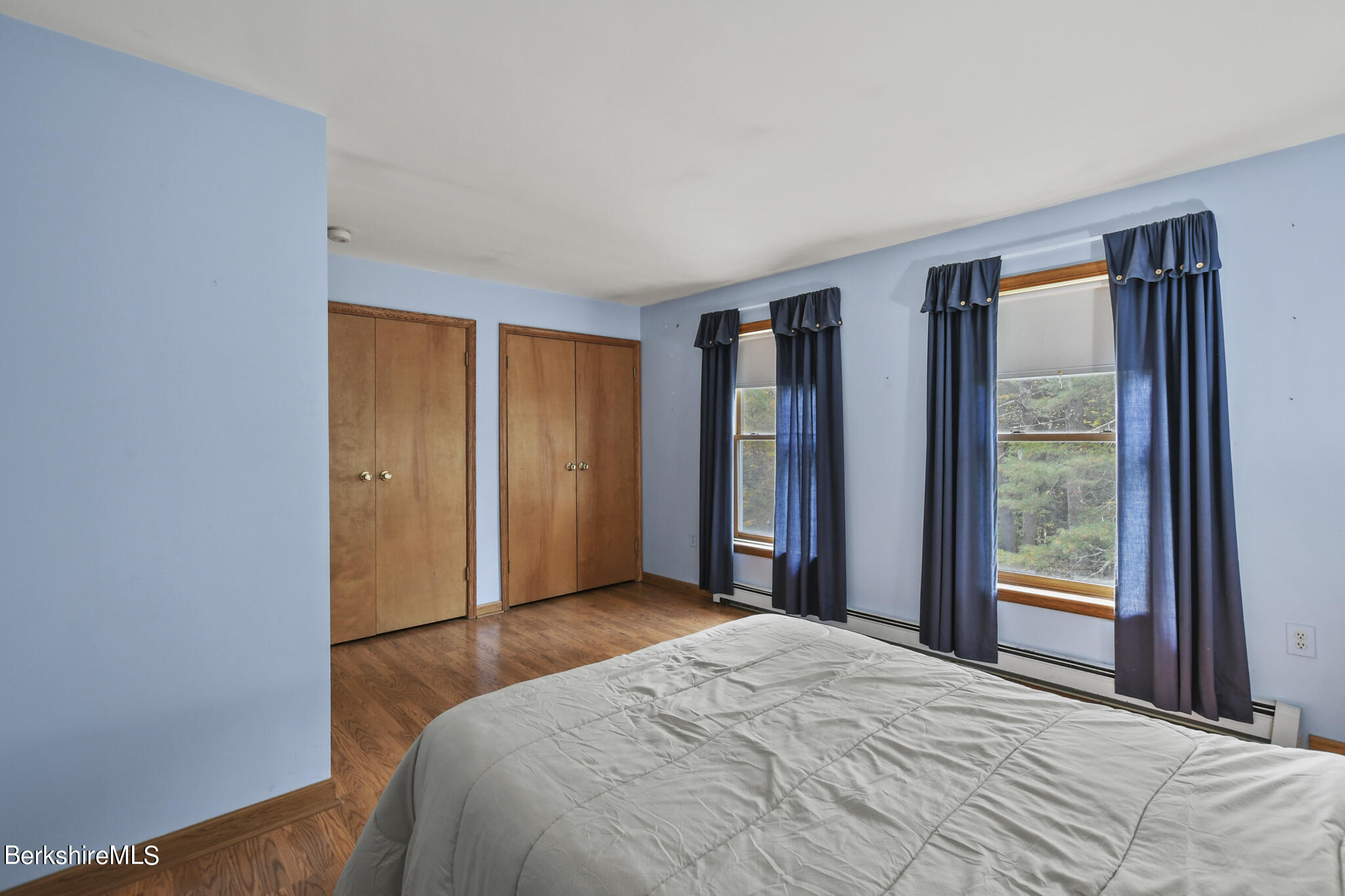 781 E Road Clarksburg, MA 01247 - Photo 33 of 51 a bedroom with a bed and a large window