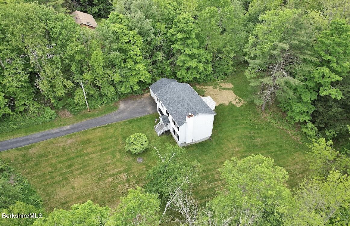781 E Road Clarksburg, MA 01247 - Photo 47 of 51 a backyard of a house with yard and outdoor seating