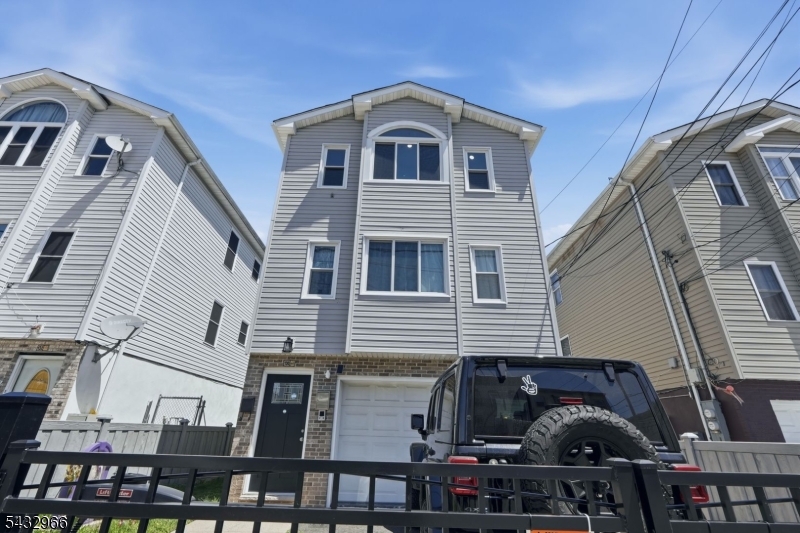 130 3rd Street, Unit 2 Passaic, NJ 07055 - Photo 11 of 12 a front view of a house