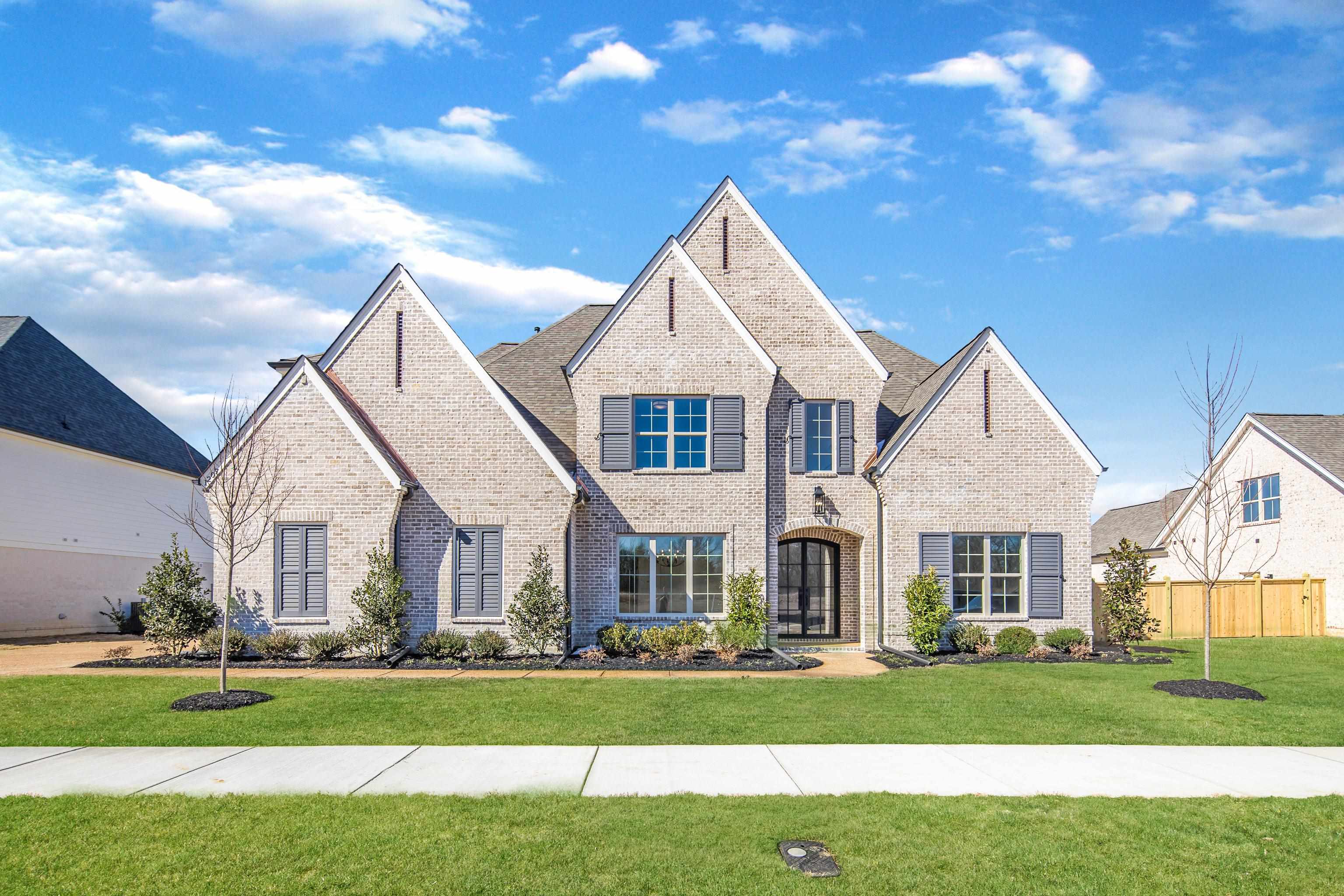 1207 Pipit Drive Collierville, TN 38017 - Photo 1 of 35 front view of a house with a yard