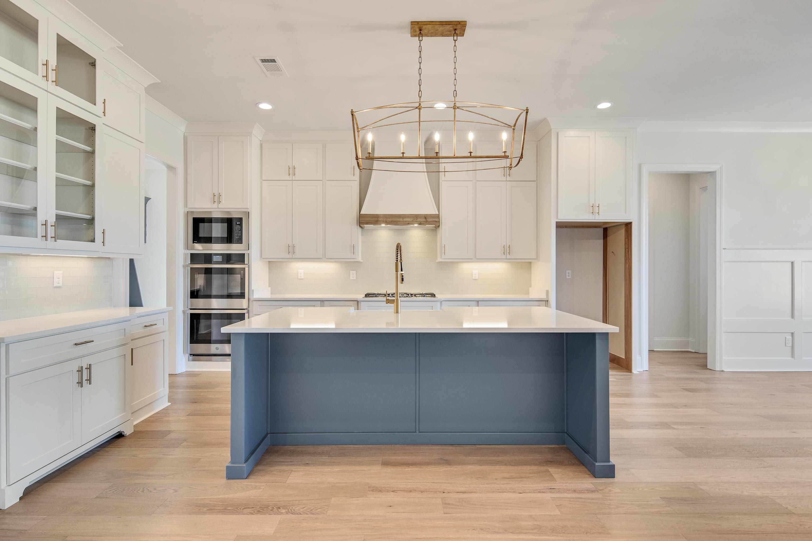 1207 Pipit Drive Collierville, TN 38017 - Photo 12 of 35 a large kitchen with kitchen island a sink stainless steel appliances and cabinets