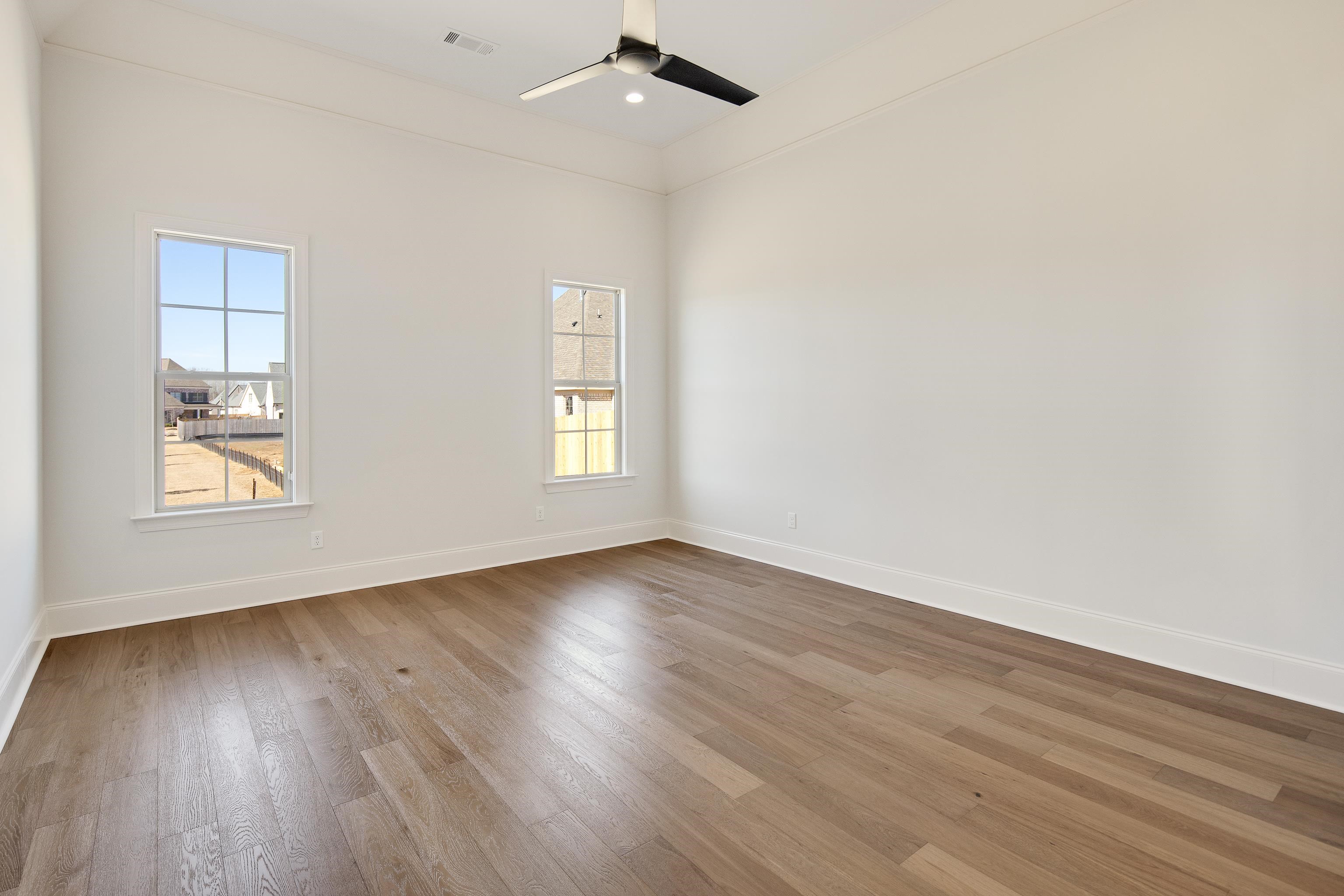1207 Pipit Drive Collierville, TN 38017 - Photo 18 of 35 wooden floor in an empty room with a window