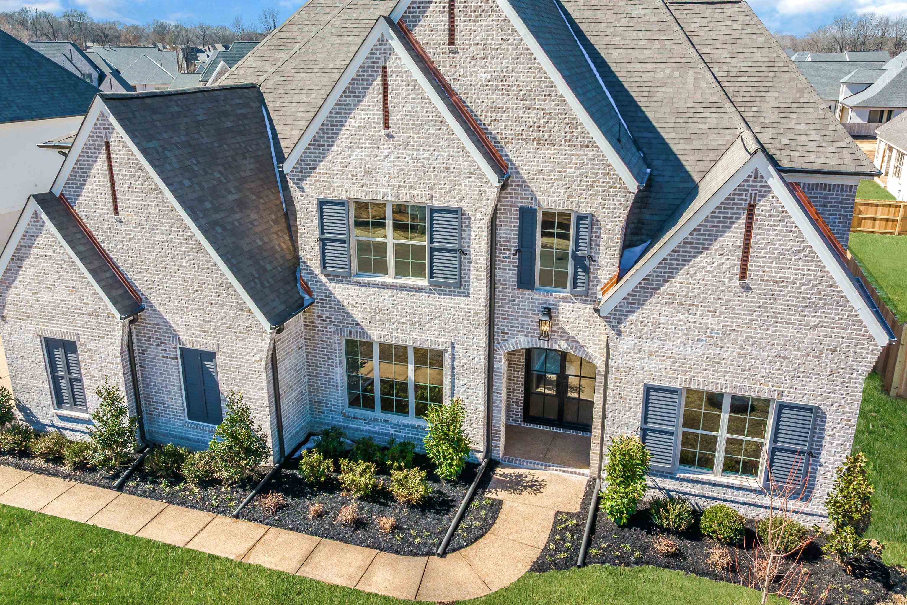 1207 Pipit Drive Collierville, TN 38017 - Photo 2 of 35 a front view of a house with a yard