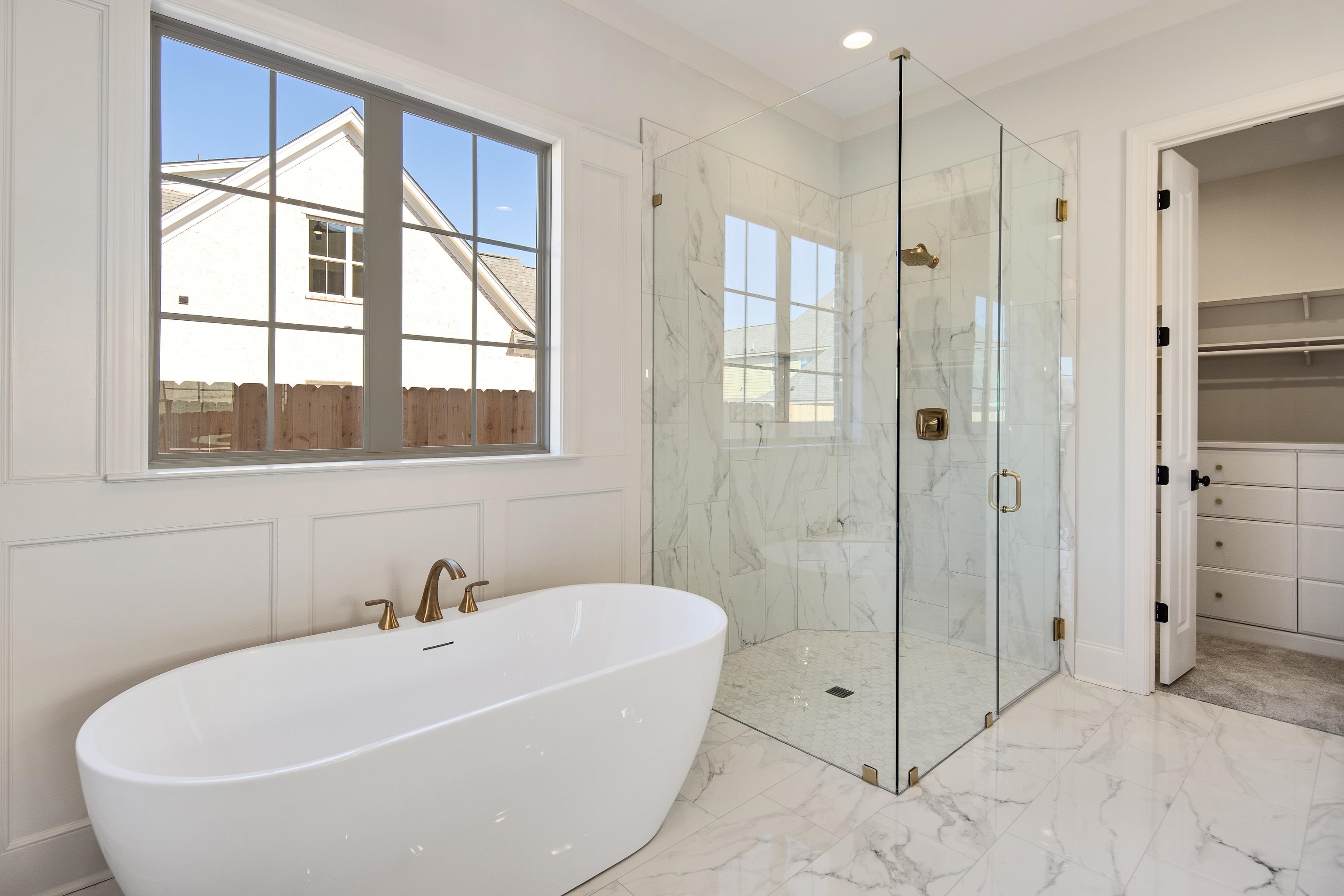 1207 Pipit Drive Collierville, TN 38017 - Photo 21 of 35 a white bath tub sitting next to a shower