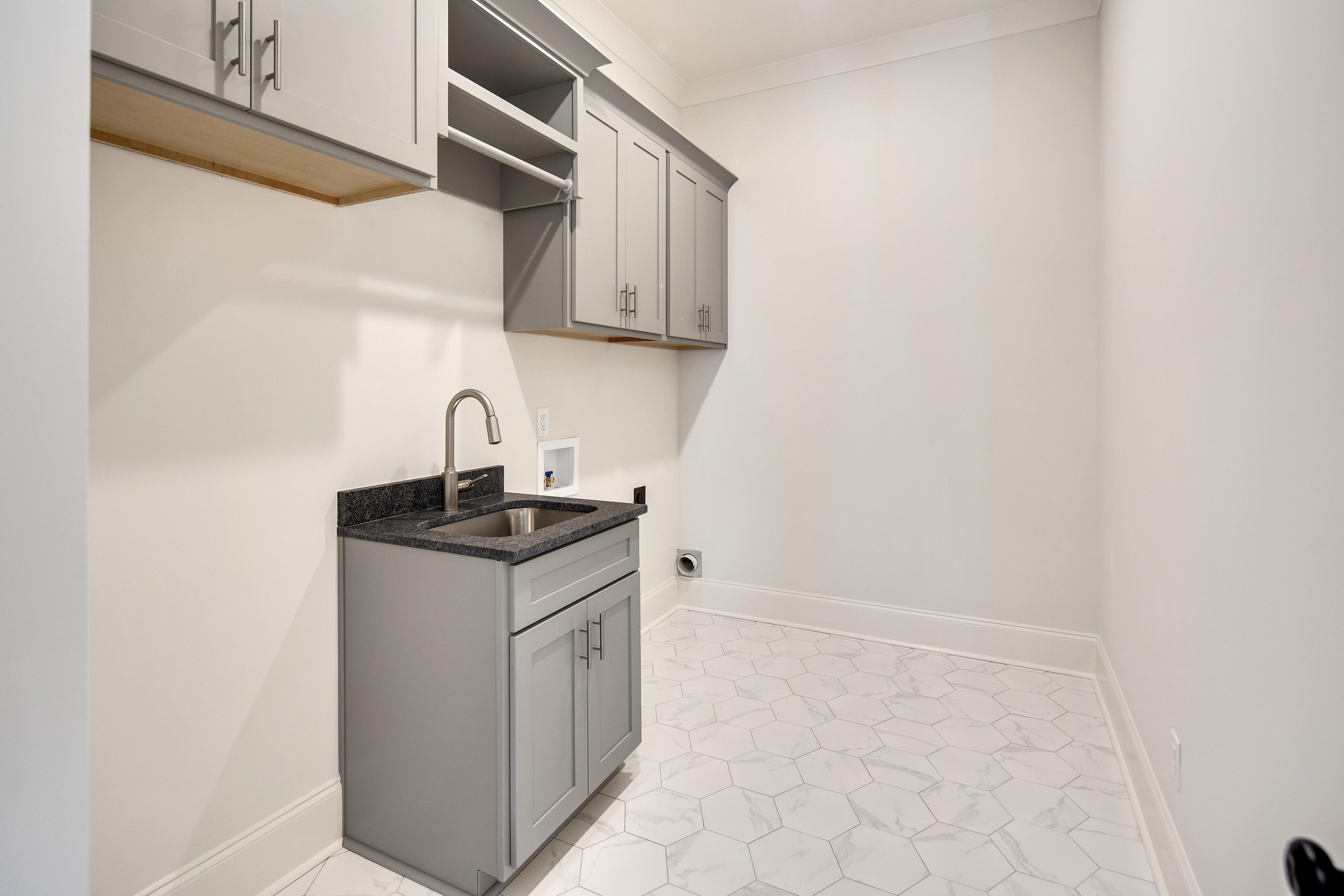 1207 Pipit Drive Collierville, TN 38017 - Photo 24 of 35 a kitchen with stainless steel appliances granite countertop a sink and a stove