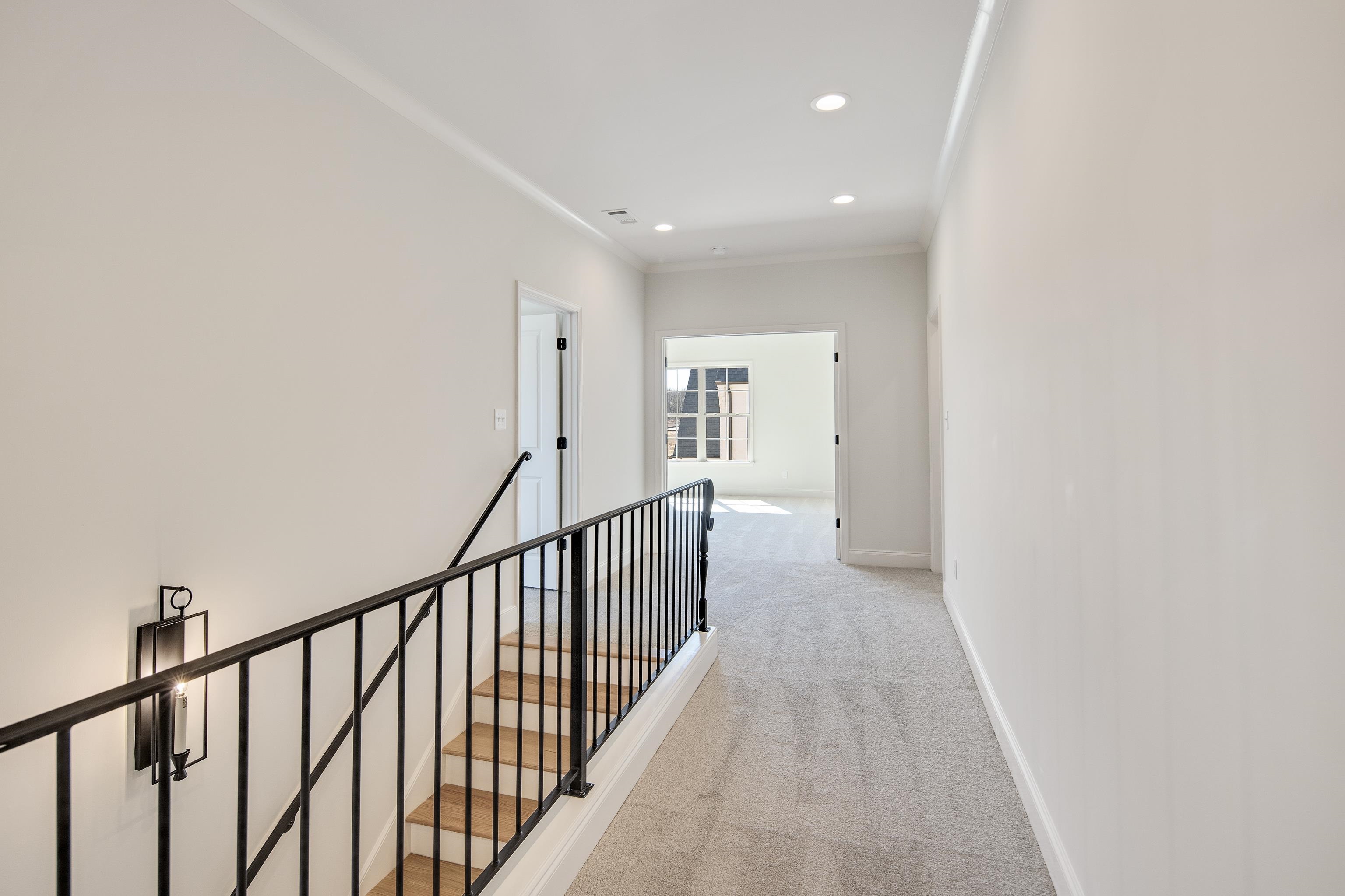 1207 Pipit Drive Collierville, TN 38017 - Photo 26 of 35 a view of a hallway with wooden floor