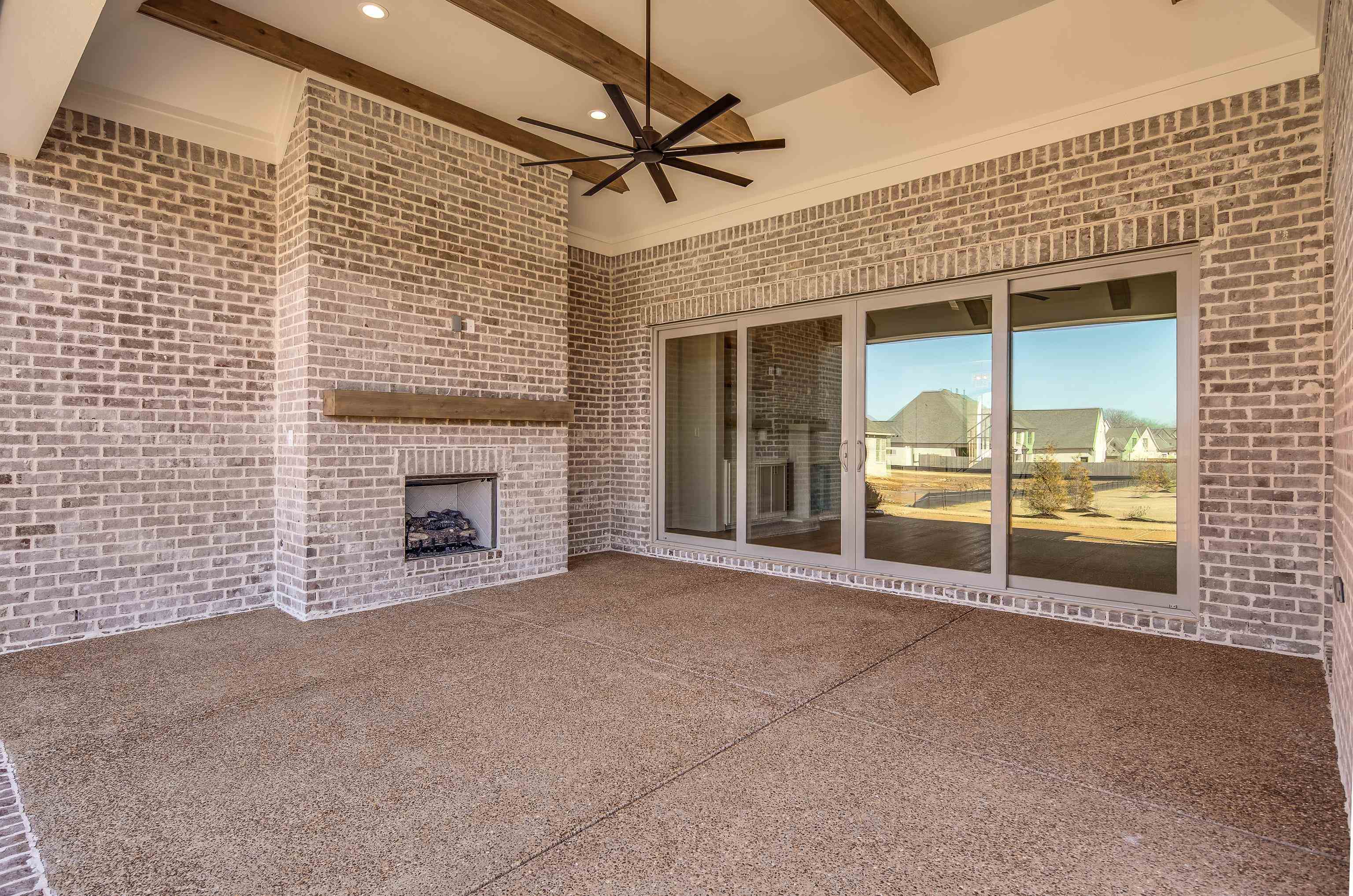 1207 Pipit Drive Collierville, TN 38017 - Photo 29 of 35 a view of a livingroom with a fireplace and a ceiling fan