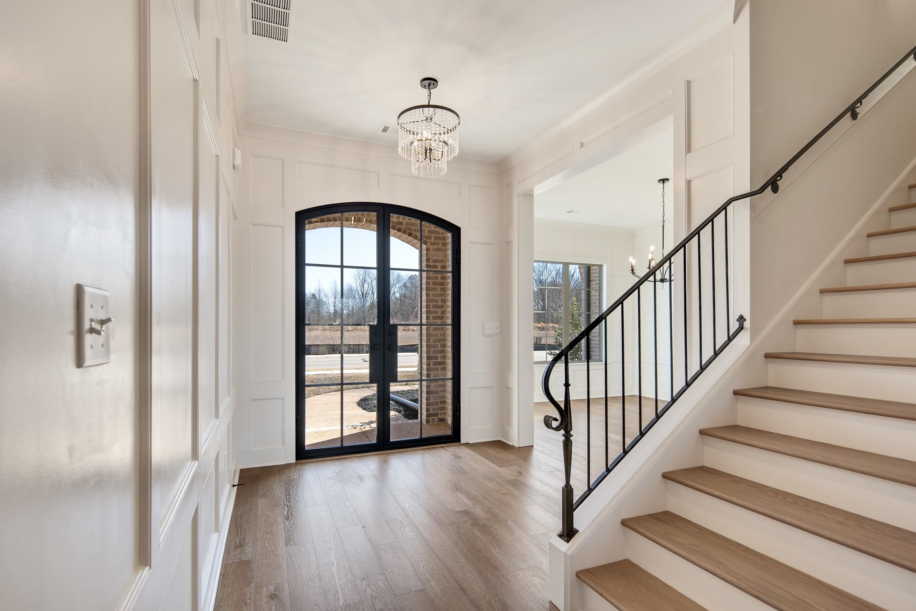 1207 Pipit Drive Collierville, TN 38017 - Photo 4 of 35 a view of a hallway with wooden floor and entryway