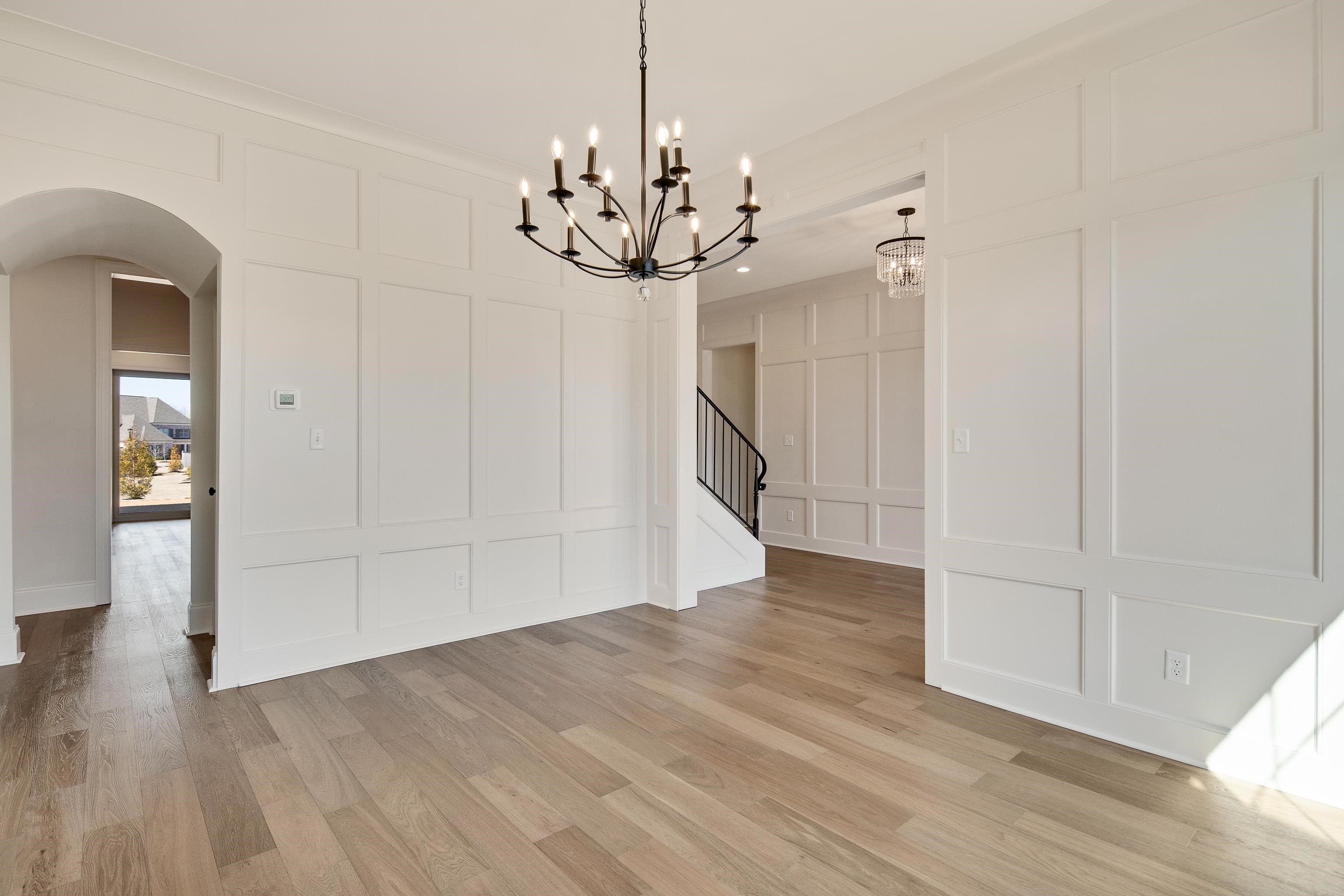 1207 Pipit Drive Collierville, TN 38017 - Photo 7 of 35 wooden floor in an empty room with a window
