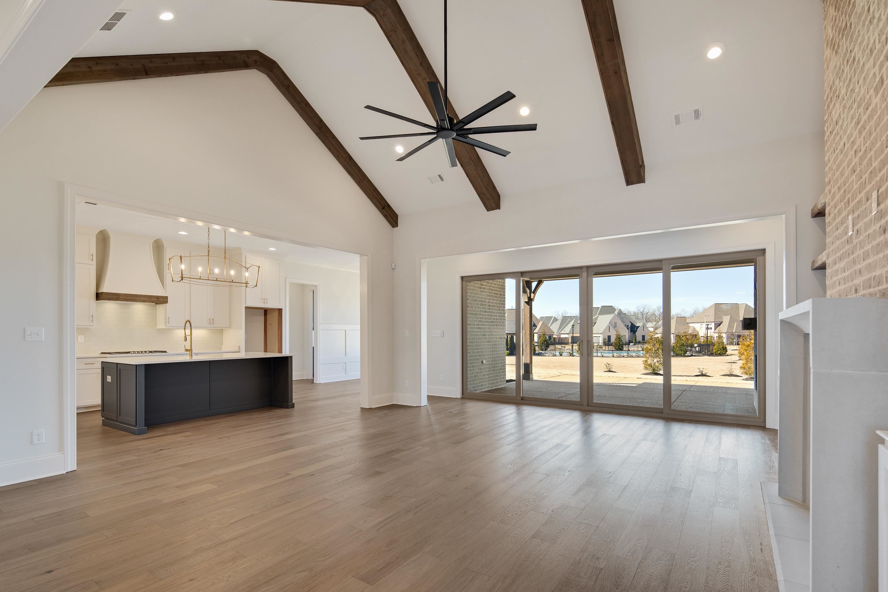 1207 Pipit Drive Collierville, TN 38017 - Photo 8 of 35 a view of an empty room with a window and wooden floor