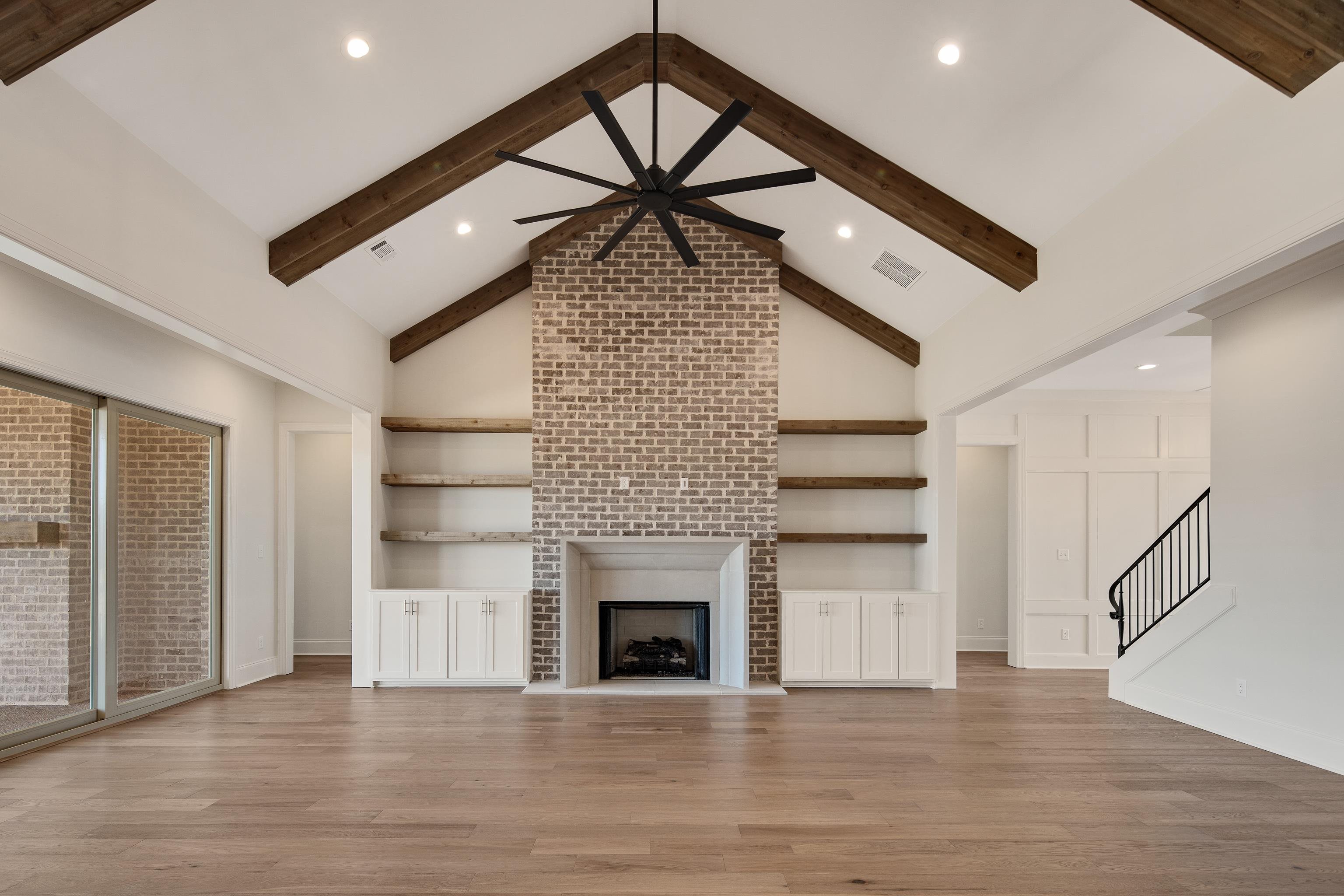 1207 Pipit Drive Collierville, TN 38017 - Photo 10 of 35 a view of a hallway with wooden floor and staircase