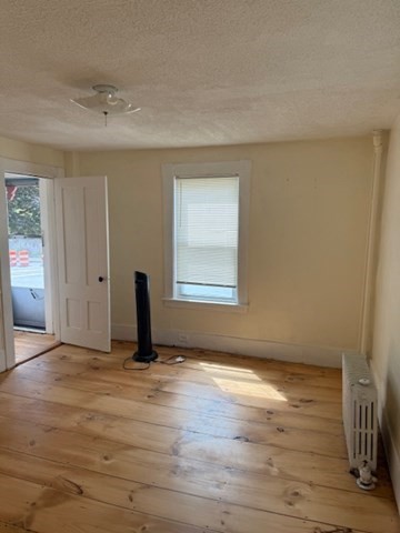 113 West Main Street, Unit 113 Ayer, MA 01432 - Photo 2 of 17 a view of an empty room and window