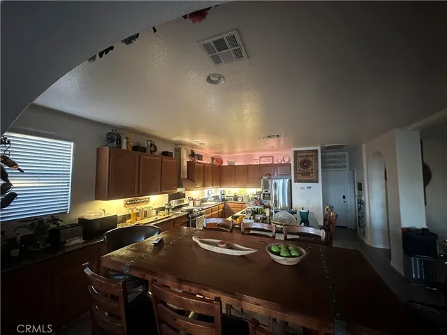 a view of a dining table and chairs in the kitchen