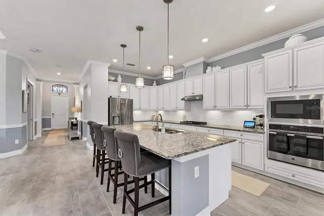 a view of a dining room with furniture and window