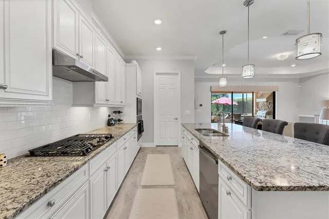 a spacious bedroom with a bed and a couch