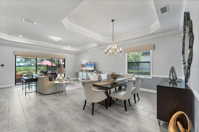 a spacious bedroom with a bed and a dresser