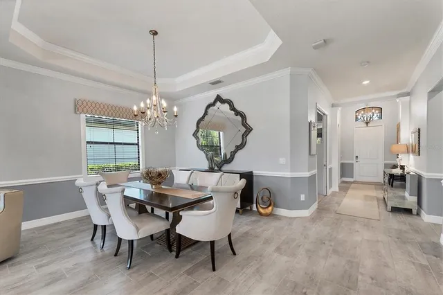 a bathroom with a granite countertop bathtub a sink and a large mirror