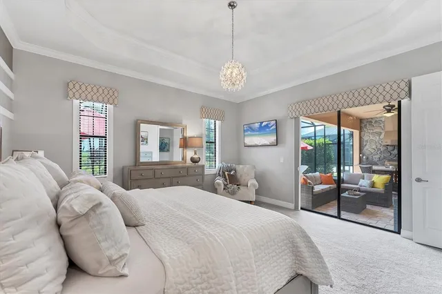 a bedroom with a large bed and a mirror on dresser