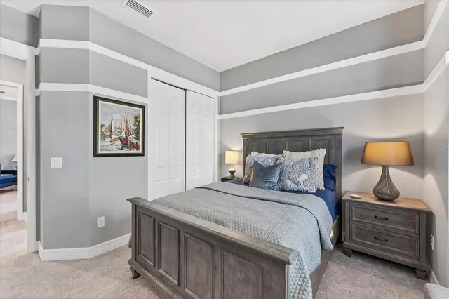 a view of a swimming pool with a patio and a yard