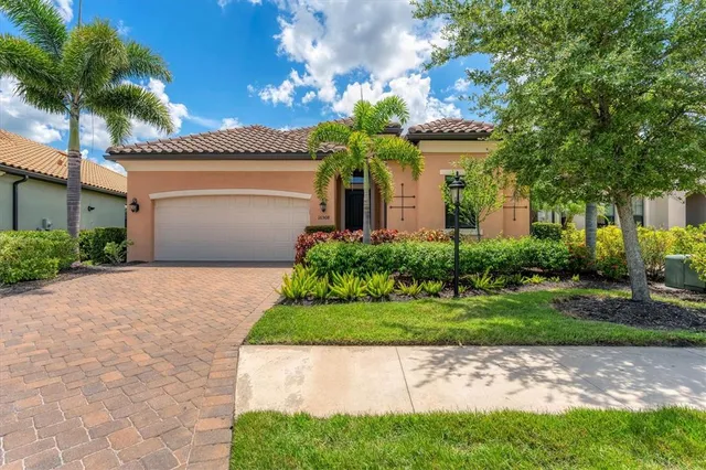 an aerial view of a house with a lake view