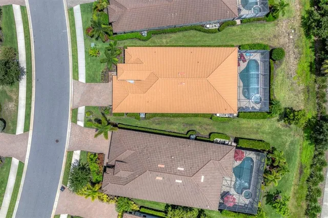 an aerial view of a house with a garden space