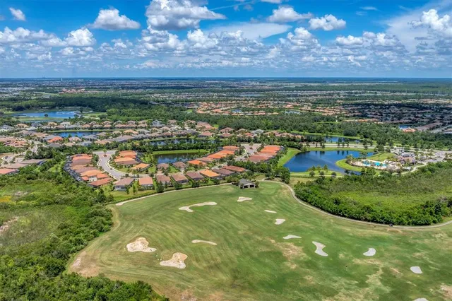 a view of a swimming pool and mountain in the back