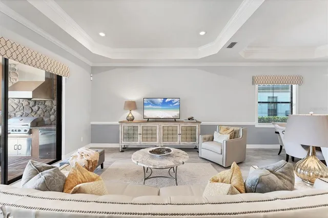 a kitchen with kitchen island granite countertop a sink stainless steel appliances and white cabinets