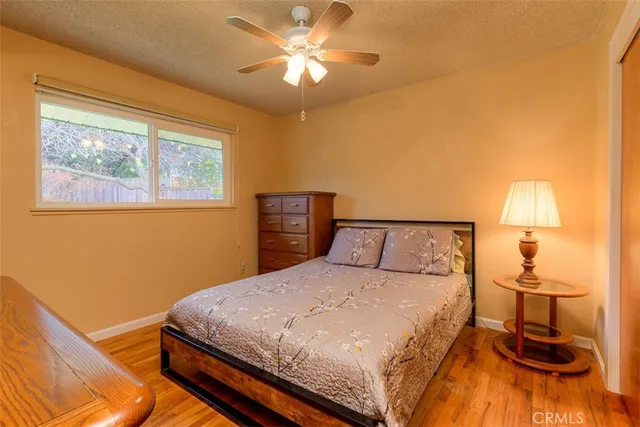 a bedroom with a bed and a lamp