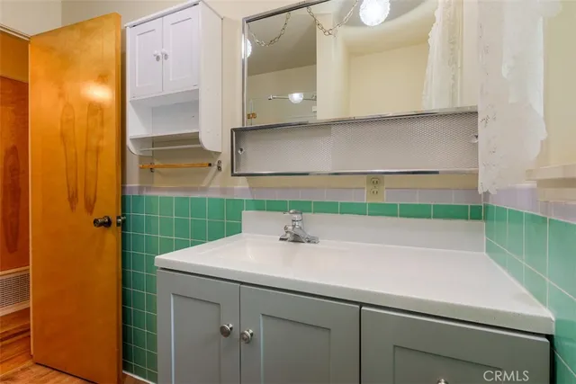 a bathroom with a sink and a mirror