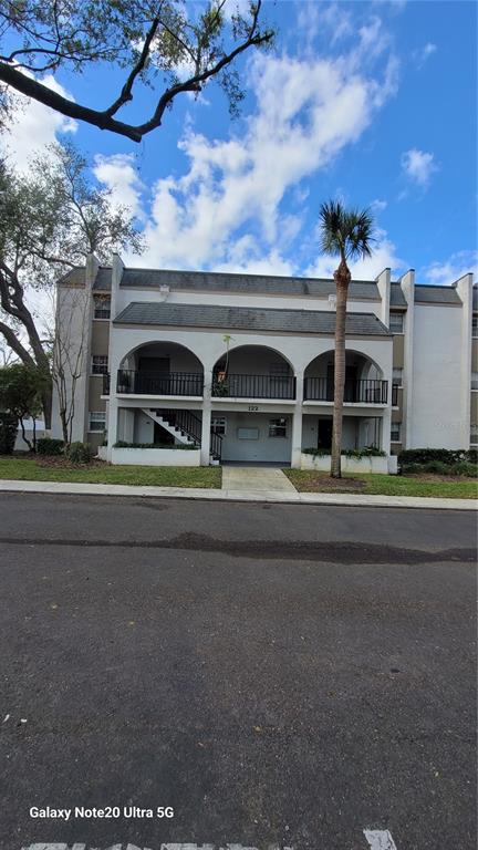 122 North Kings Avenue, Unit 202 Brandon, FL 33510 - Photo 1 of 12 a front view of a house with a yard
