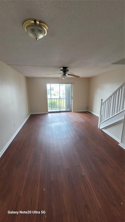 122 North Kings Avenue, Unit 202 Brandon, FL 33510 - Photo 4 of 12 an empty room with wooden floor and windows