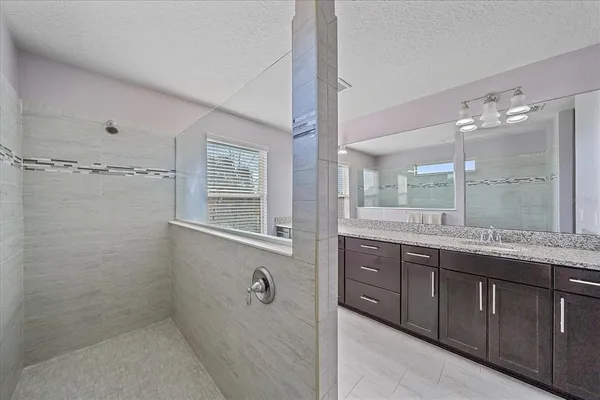 a bedroom with a bed and a table with chair