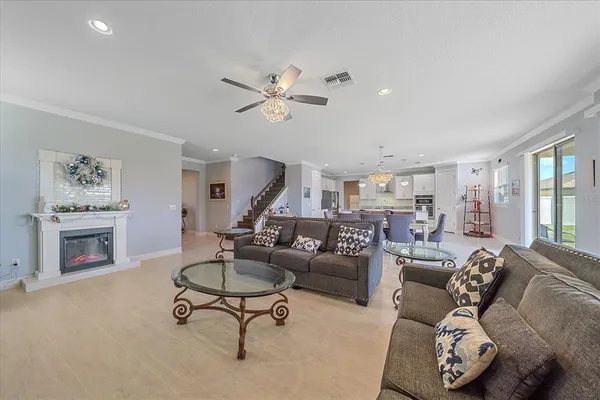 a living room with furniture and a fireplace