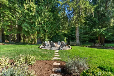 a view of a table and chairs in the garden