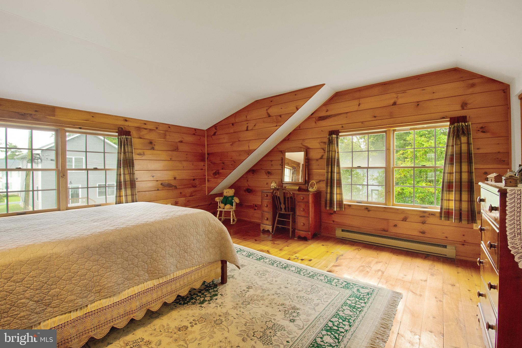 968 Main Street Deale, MD 20751 - Photo 15 of 26 a bedroom with a bed and a large window