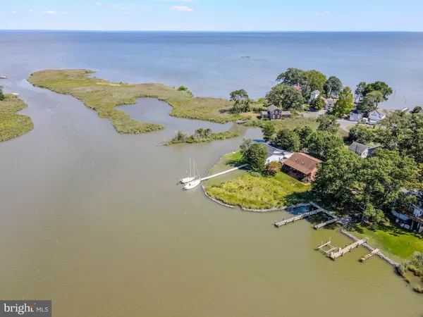 a view of a lake with a house in the background