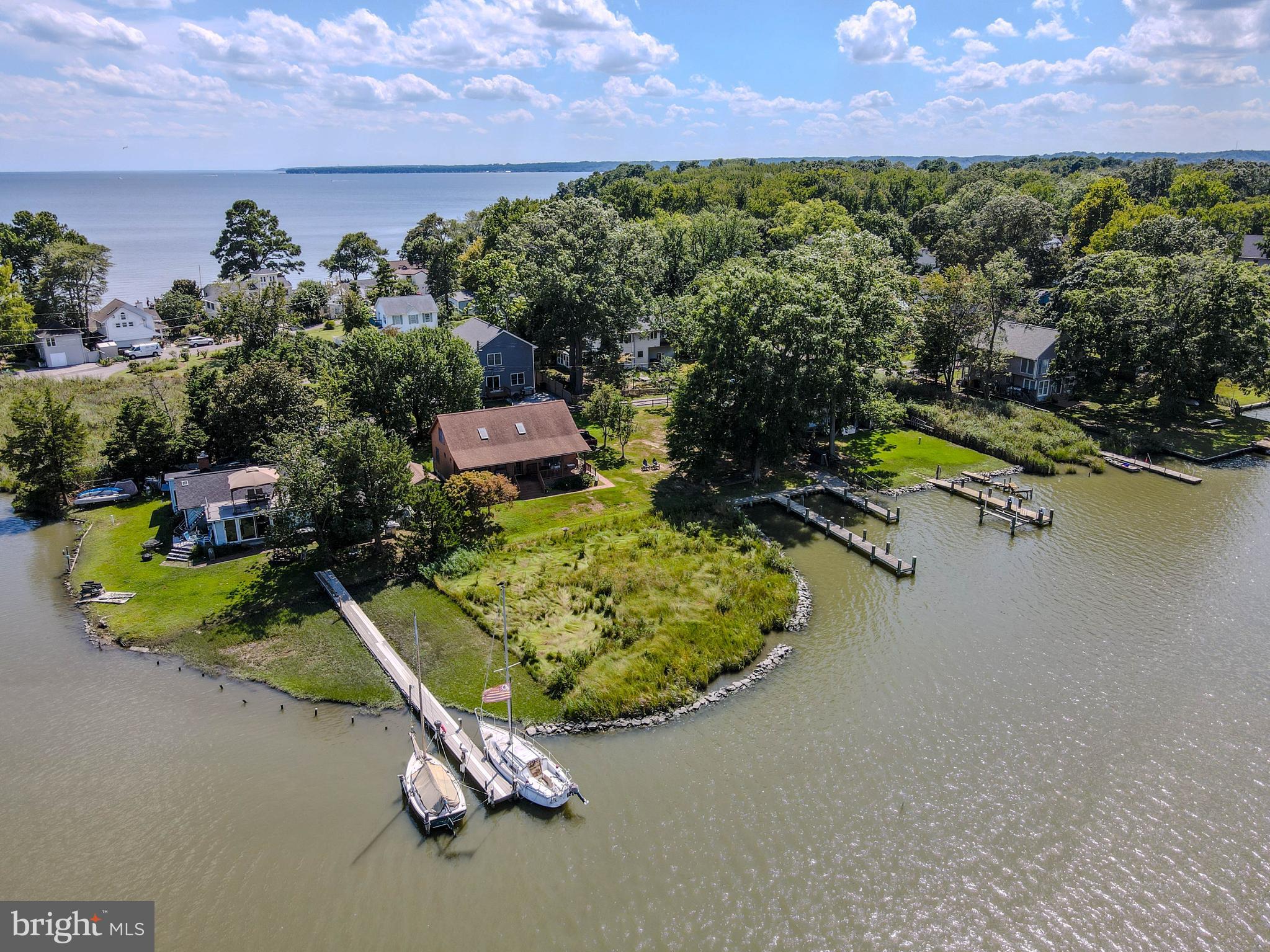 968 Main Street Deale, MD 20751 - Photo 5 of 26 an aerial view of a house with a yard and lake view