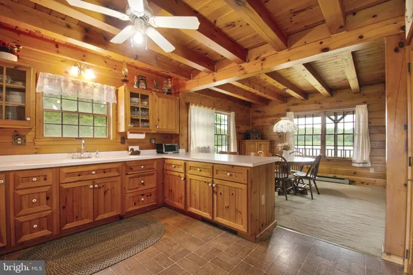 a kitchen with a refrigerator and a sink