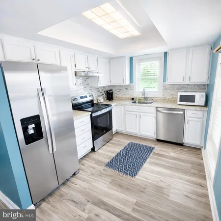 a kitchen with a cabinets and appliances