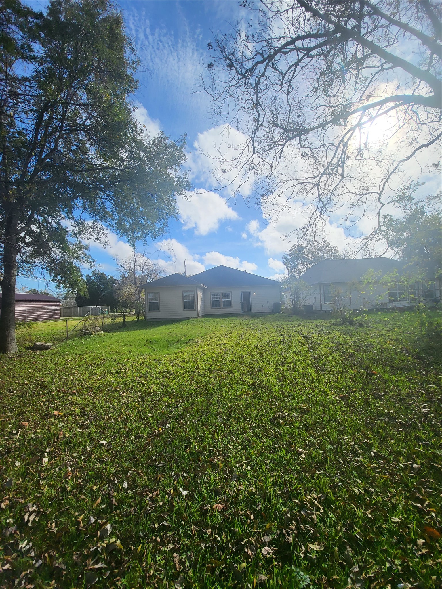 1904 Kansas Street La Marque, TX 77568 - Photo 2 of 20 a view of a big yard with large trees