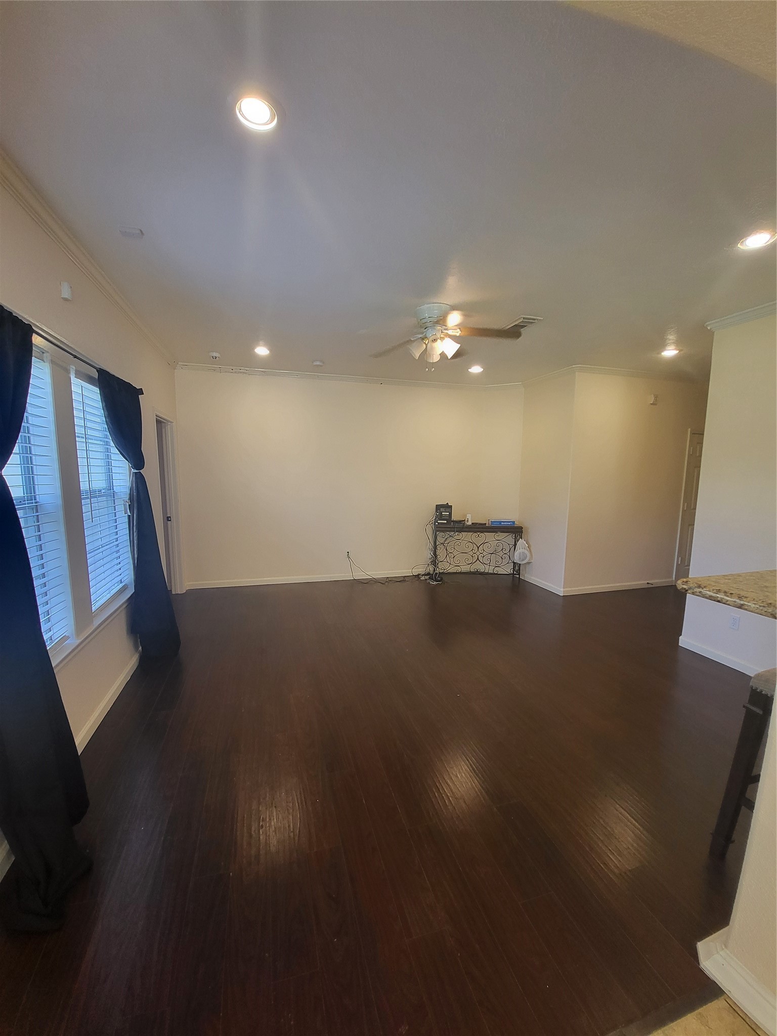 1904 Kansas Street La Marque, TX 77568 - Photo 7 of 20 a view of a room with wooden floor and staircase