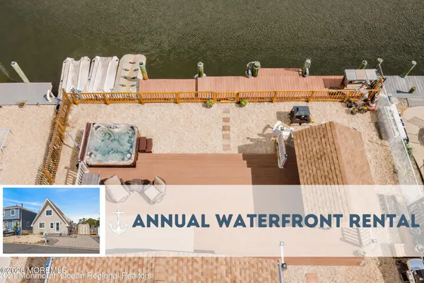 a view of a lake with outdoor seating