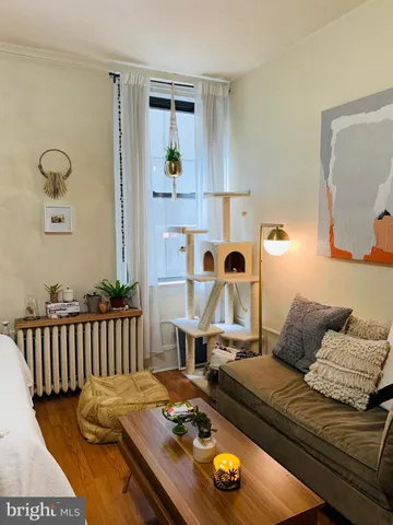 a living room with furniture and a table