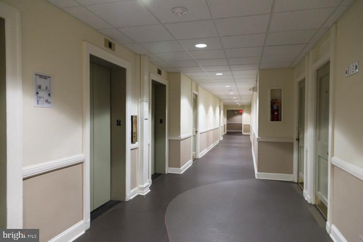 1324 Locust Street, Unit 317 Philadelphia, PA 19107 - Photo 10 of 12 a view of a hallway with wooden floor