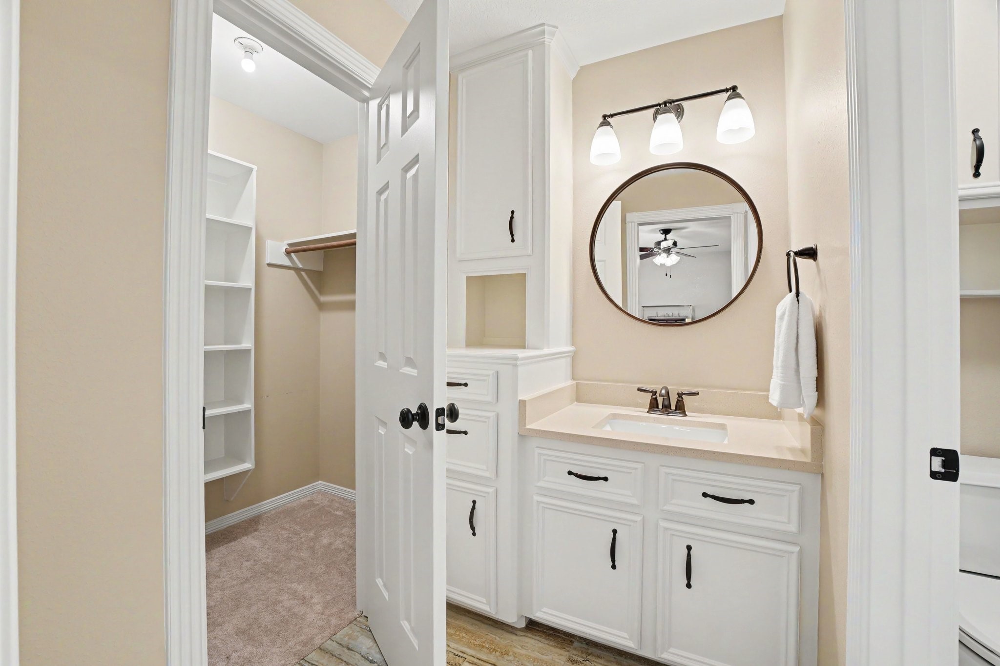 3411 Fir Forest Drive Spring, TX 77388 - Photo 28 of 39 A view of secondary bedroom 1's updated sink area with plenty of cabinet storage and large walk-in closet.