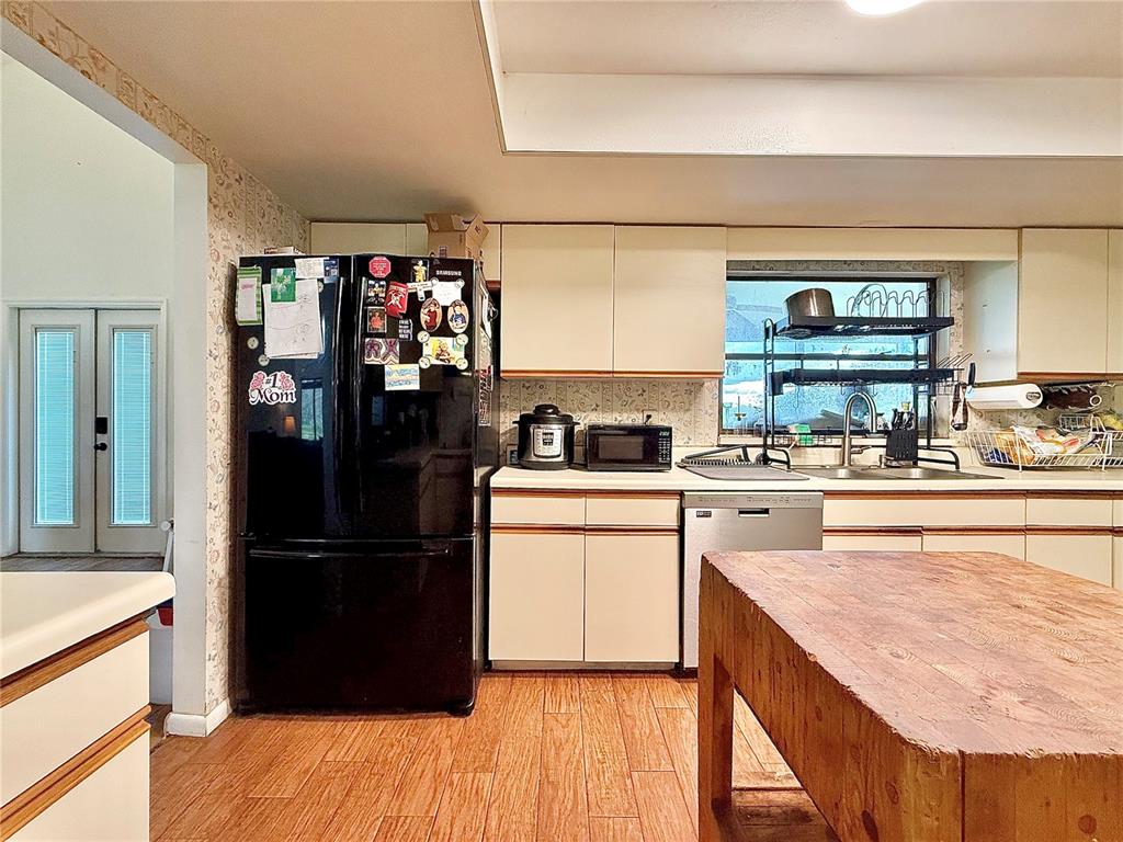 2500 Brook Road North Fort Meade, FL 33841 - Photo 16 of 65 a kitchen with a refrigerator and a stove top oven